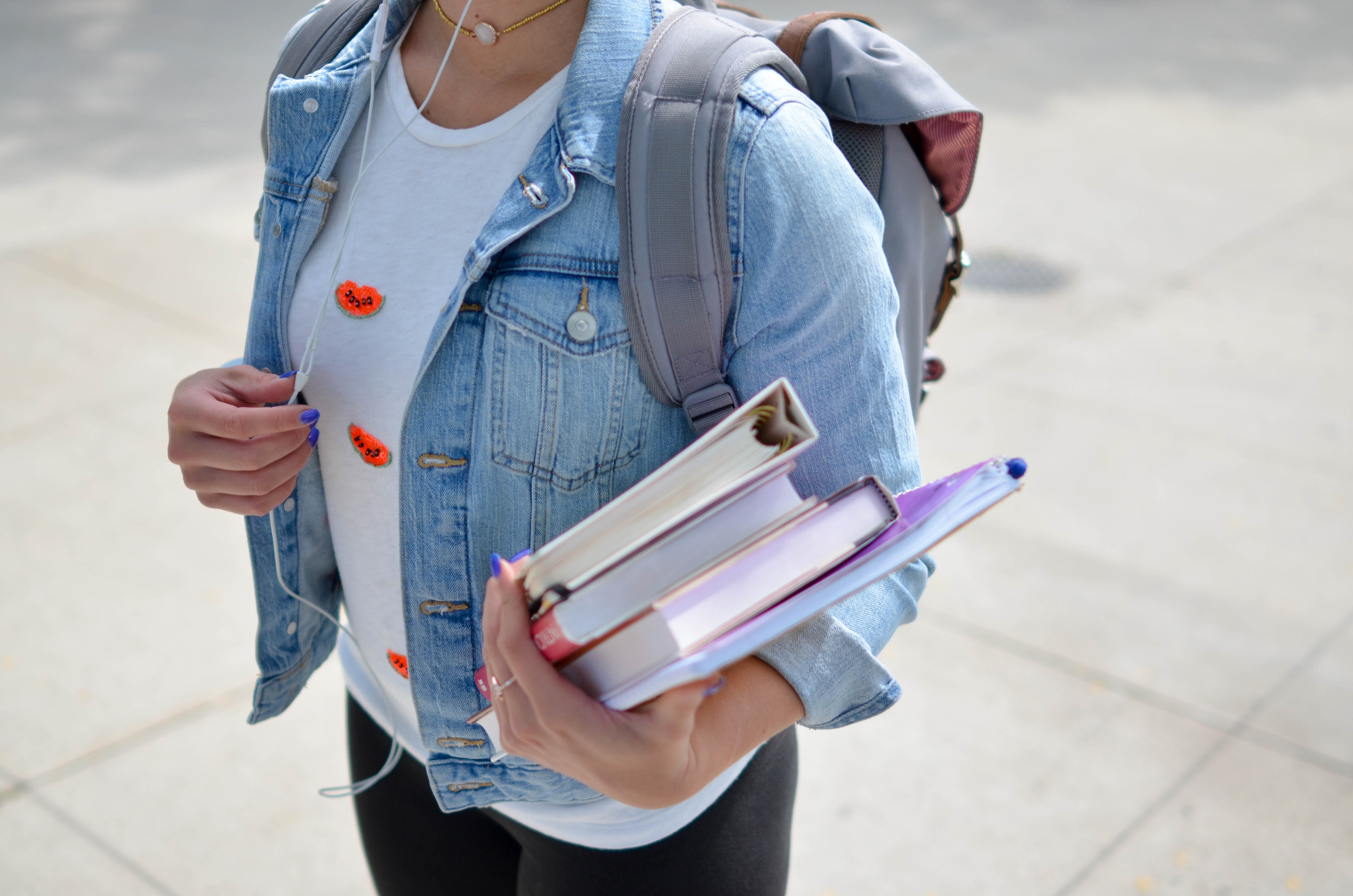 College Student carrying books