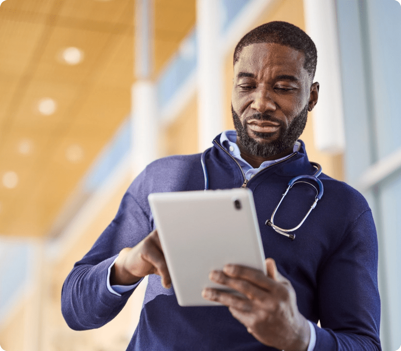 Doctor looking at tablet