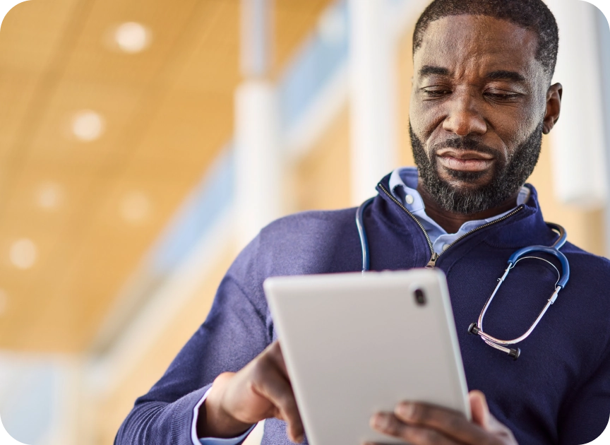 Doctor looking at tablet