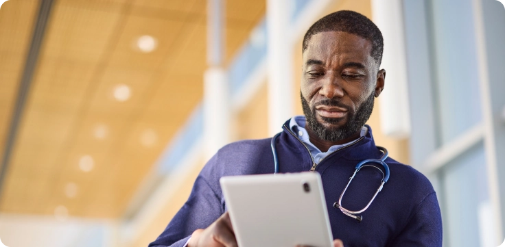 Doctor looking at tablet
