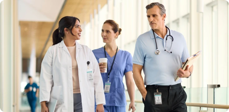 Group of physicians discussing in hospital